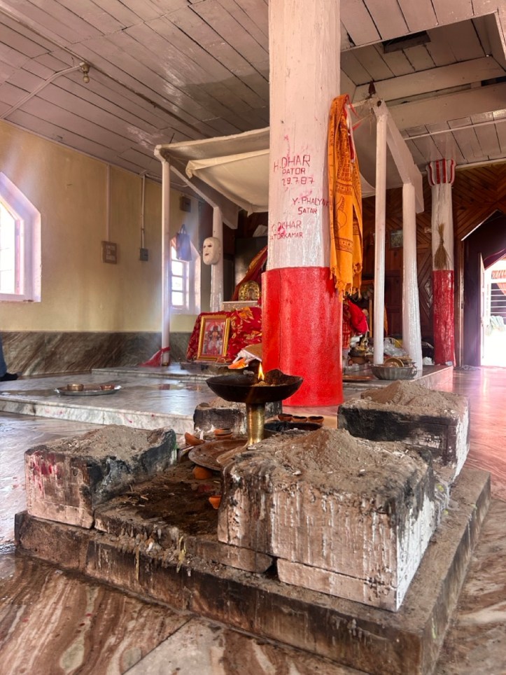 Sacrifical altar and human mask in the Durga temple in Naritang Meghalaya