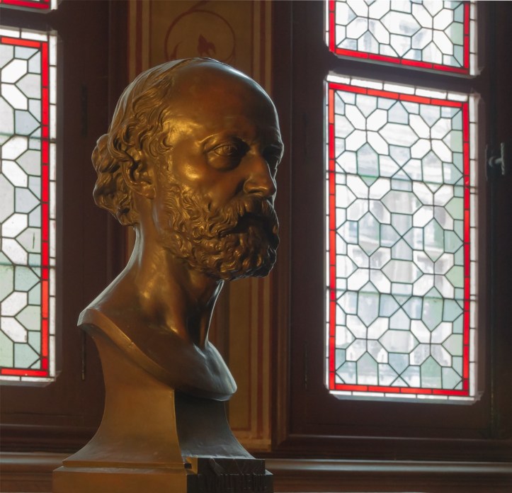 Bronze bust of Eugène Viollet-le-Duc by Ernest-Eugène Hiolle, Château de Pierrefonds, Oise. Photograph by Jebulon, 2014. CC0 / Public Domain